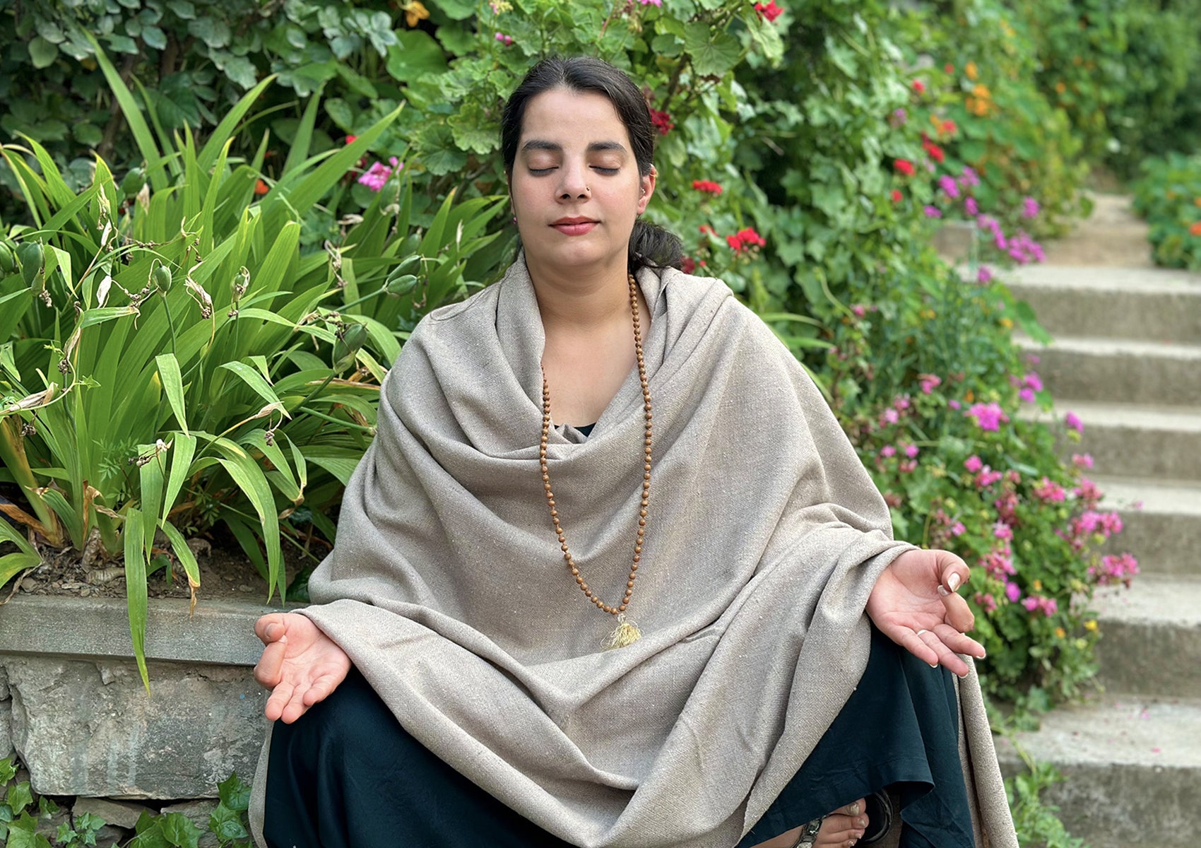 Himalayan Kailash meditation blanket in beige, used outdoors for a serene meditation experience.