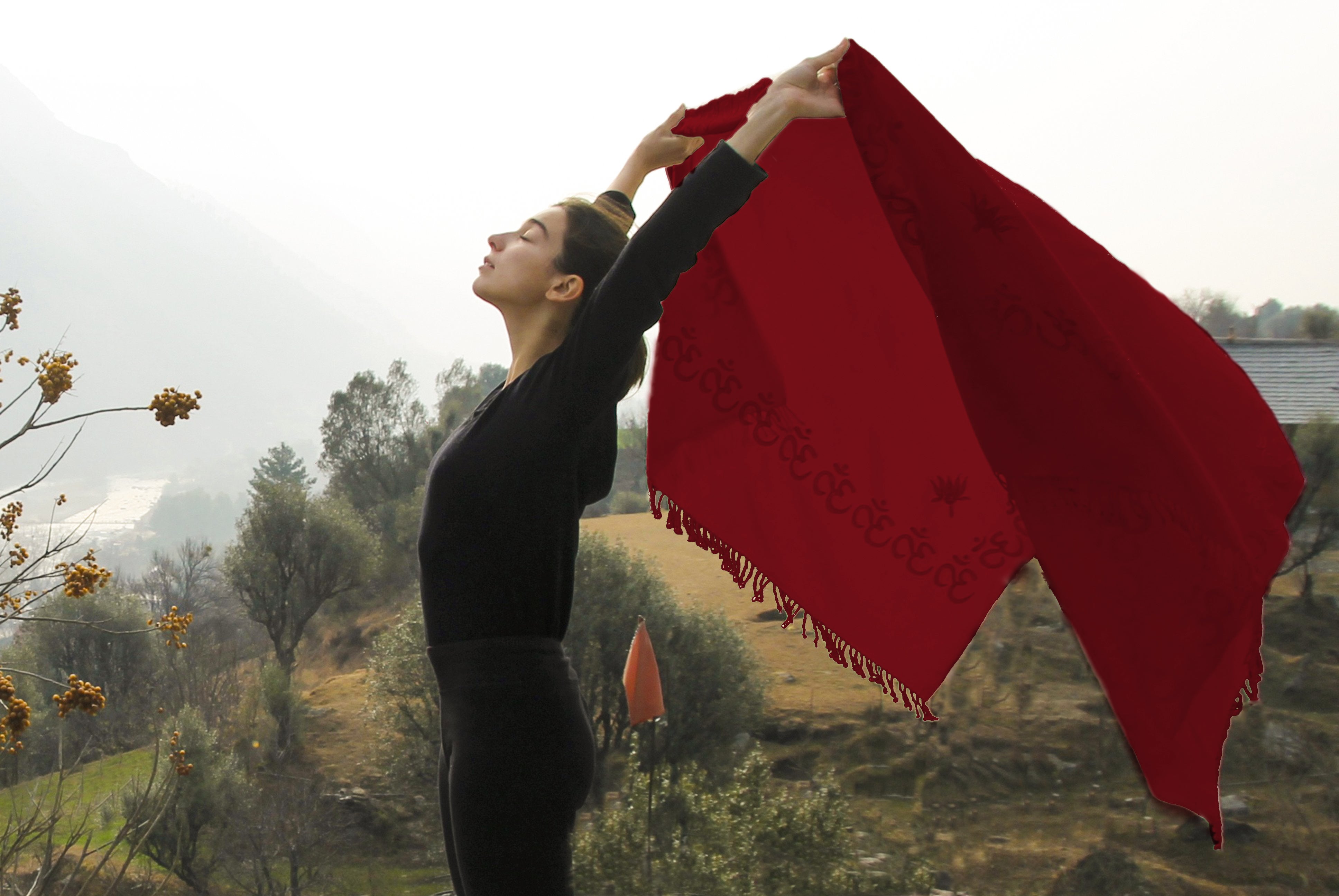 Red meditation shawl with Om symbols, ideal for peaceful sessions.