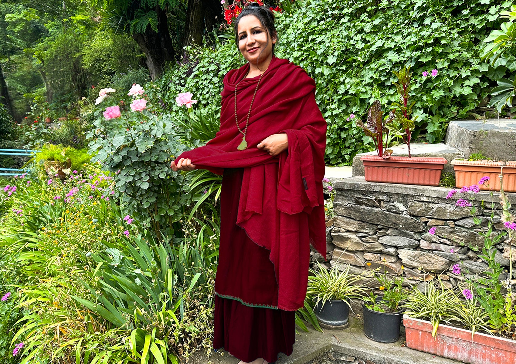 Red merino wool shawl for meditation with a close-up of the fabric texture, ideal for a peaceful practice.