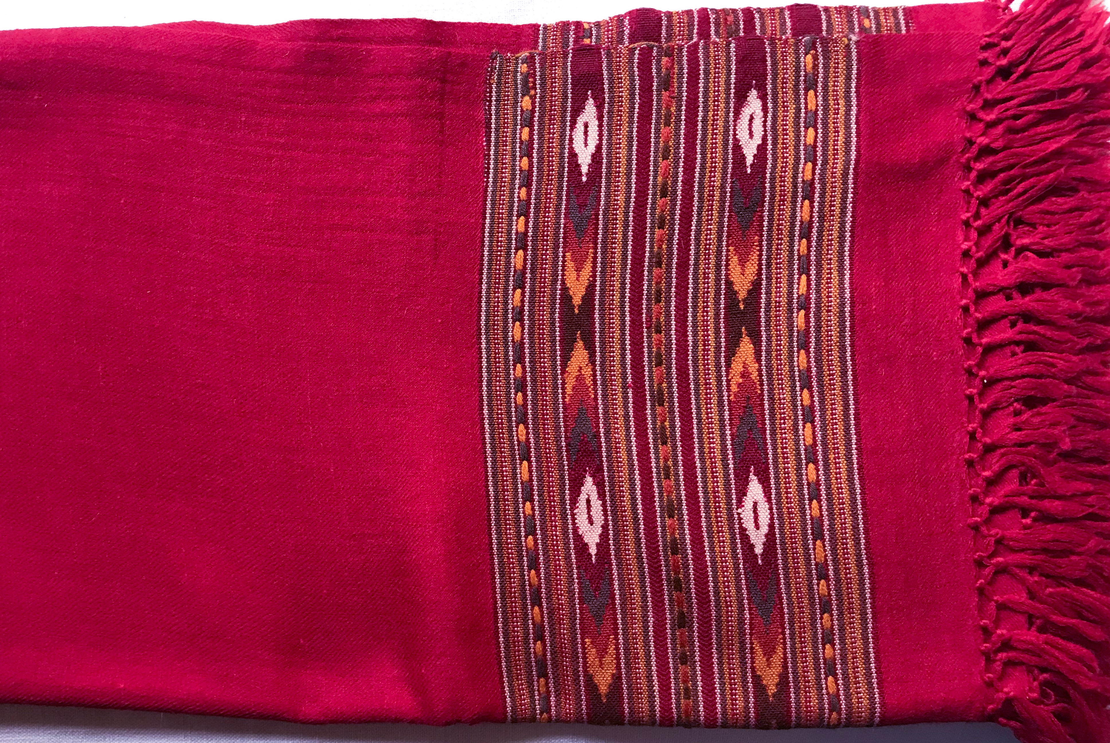 Detailed close-up of the burgundy red shawl fringe with traditional patterns for a classic ethnic look.