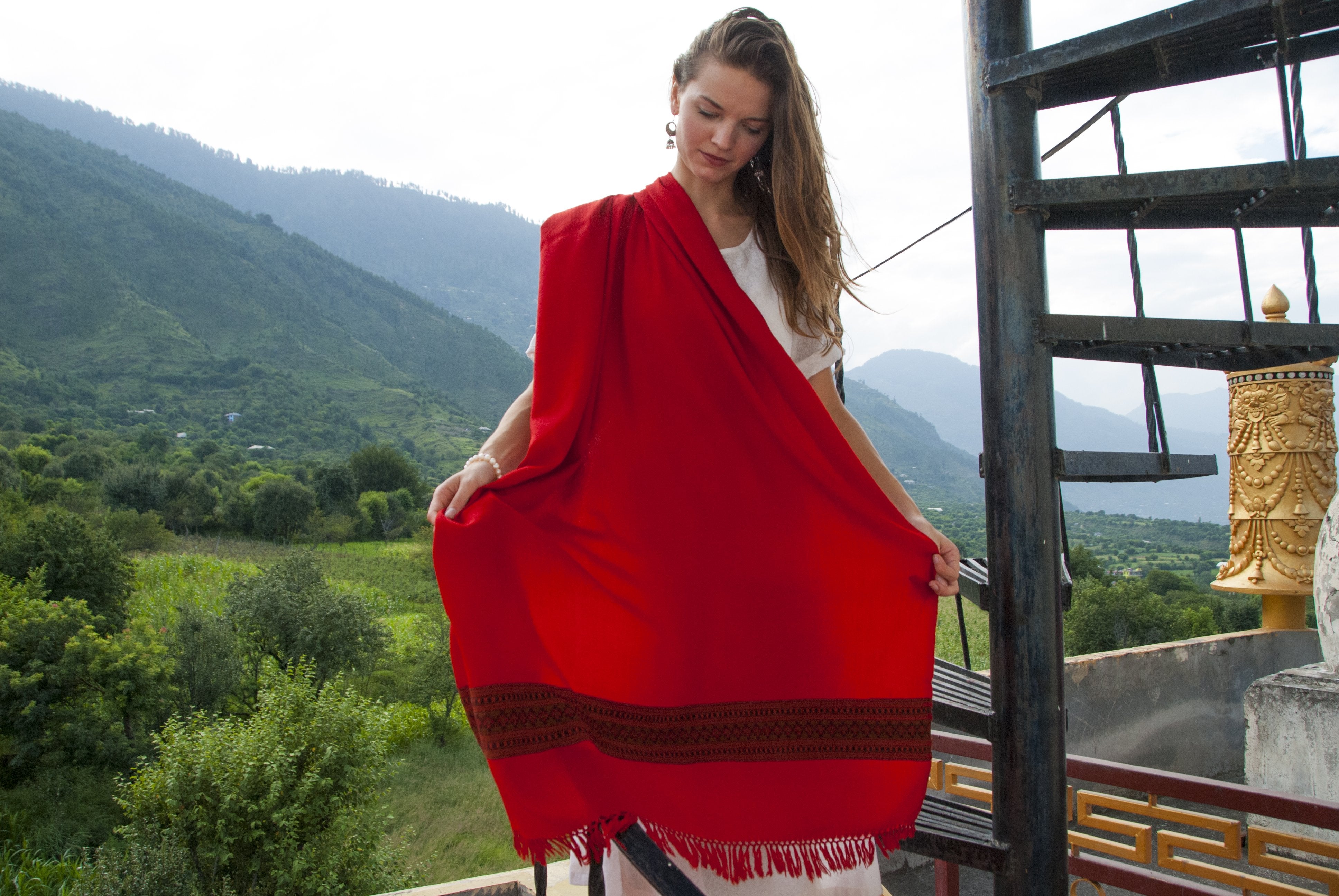 Karuna meditation shawl with an ethnic border featuring traditional Himalayan designs.