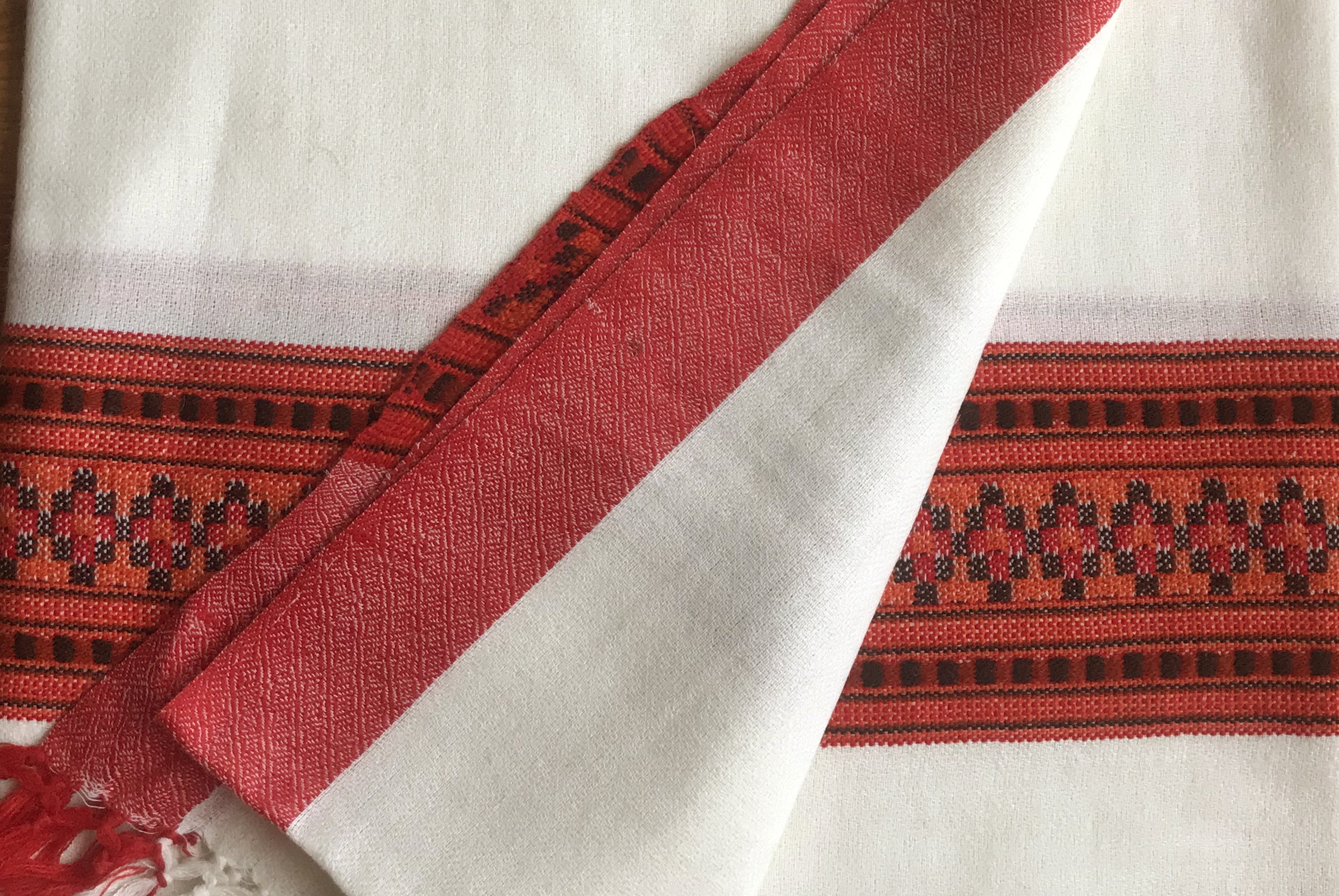 Karuna meditation shawl with ethnic red border, perfect for yoga and meditation sessions.