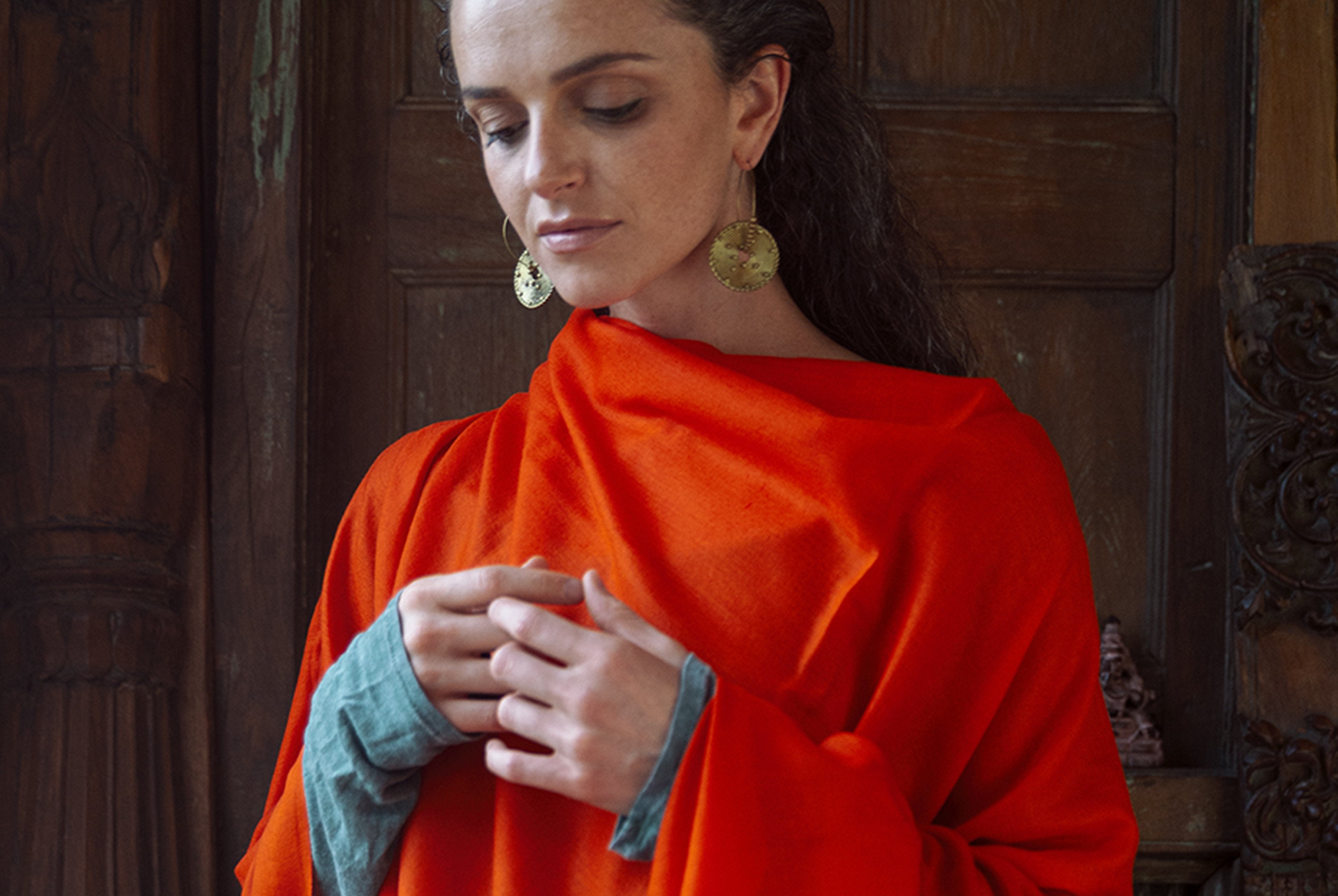 Orange shawl for women, ideal for meditation or as a stylish wrap, featuring soft, warm fabric for comfort.