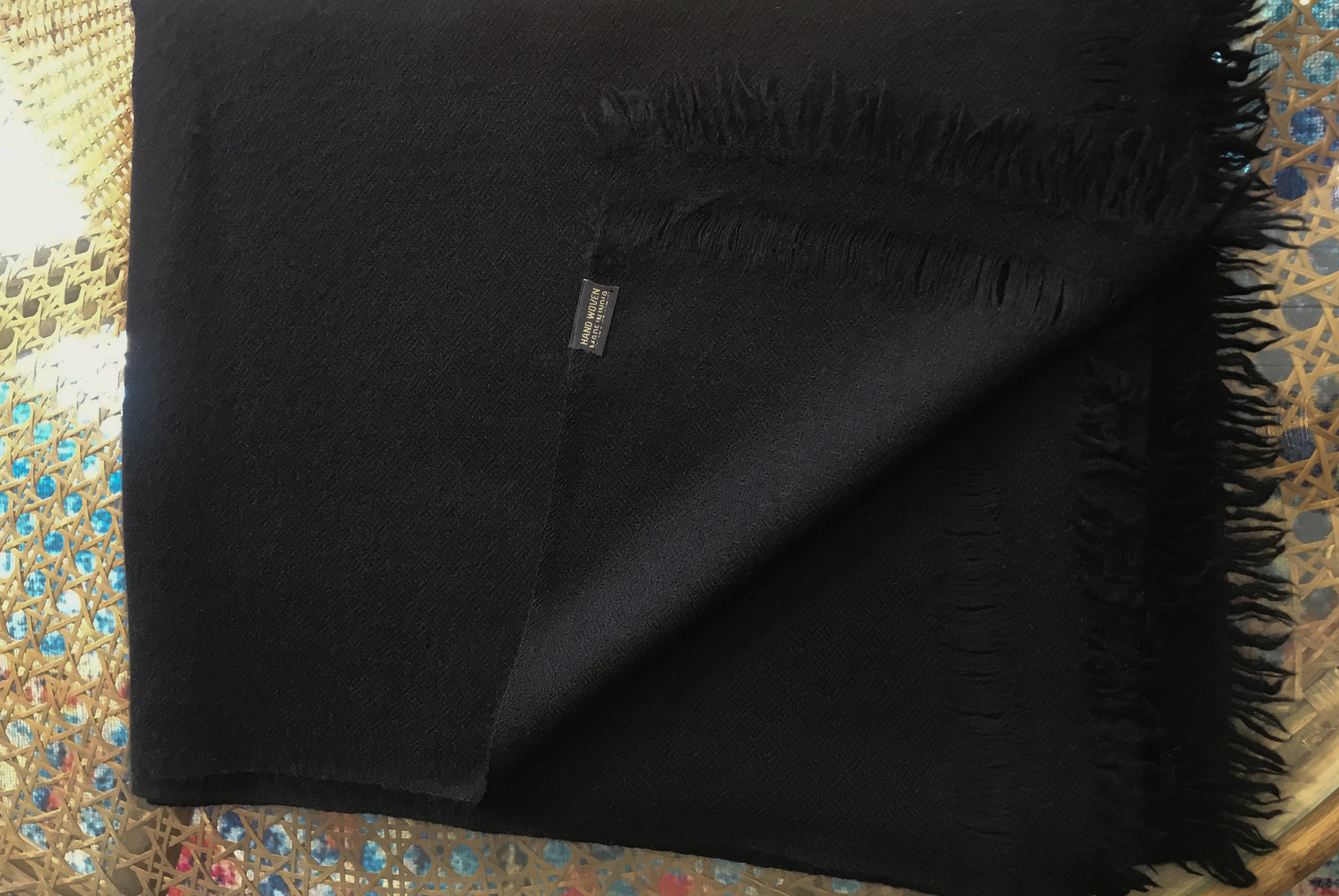 Luxurious black cashmere meditation shawl for a traditional, comforting experience.